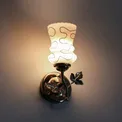 Brass wall lamp with a glass shade