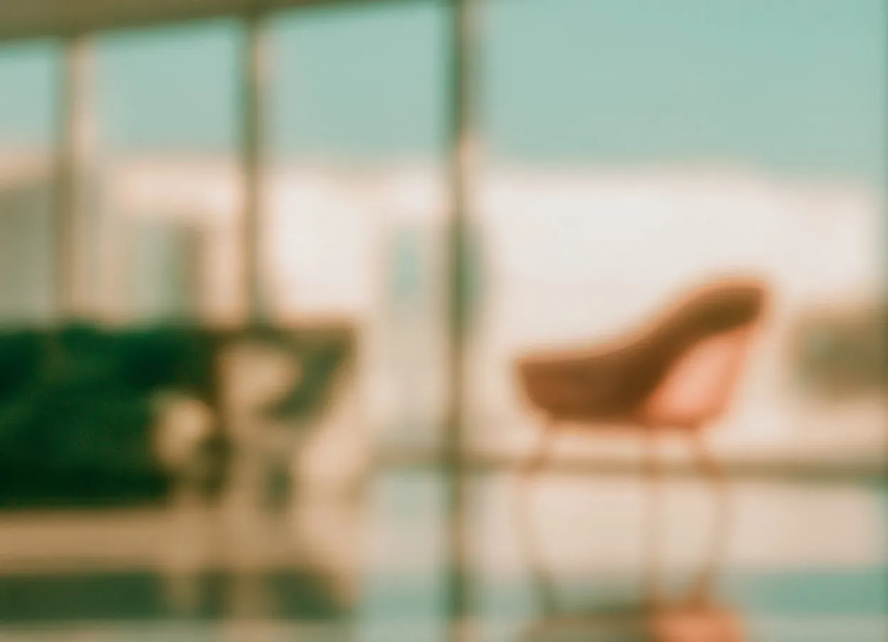 Furniture store with an armchair by the window, softly blurred