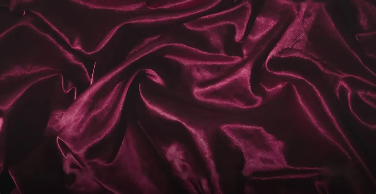 Folds of burgundy velvet