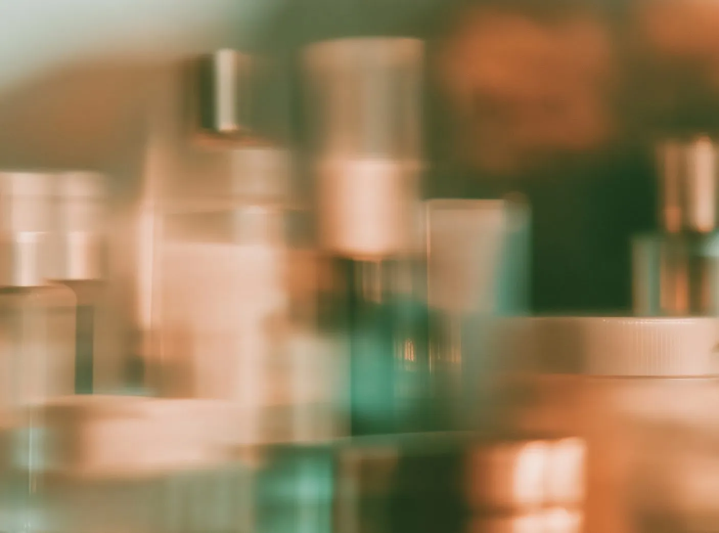 Beauty products on a shelf, softly out of focus