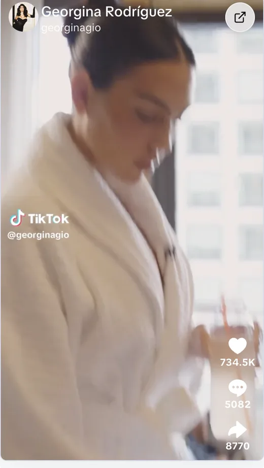 TikTok video by Georgina Rodríguez in a bathrobe